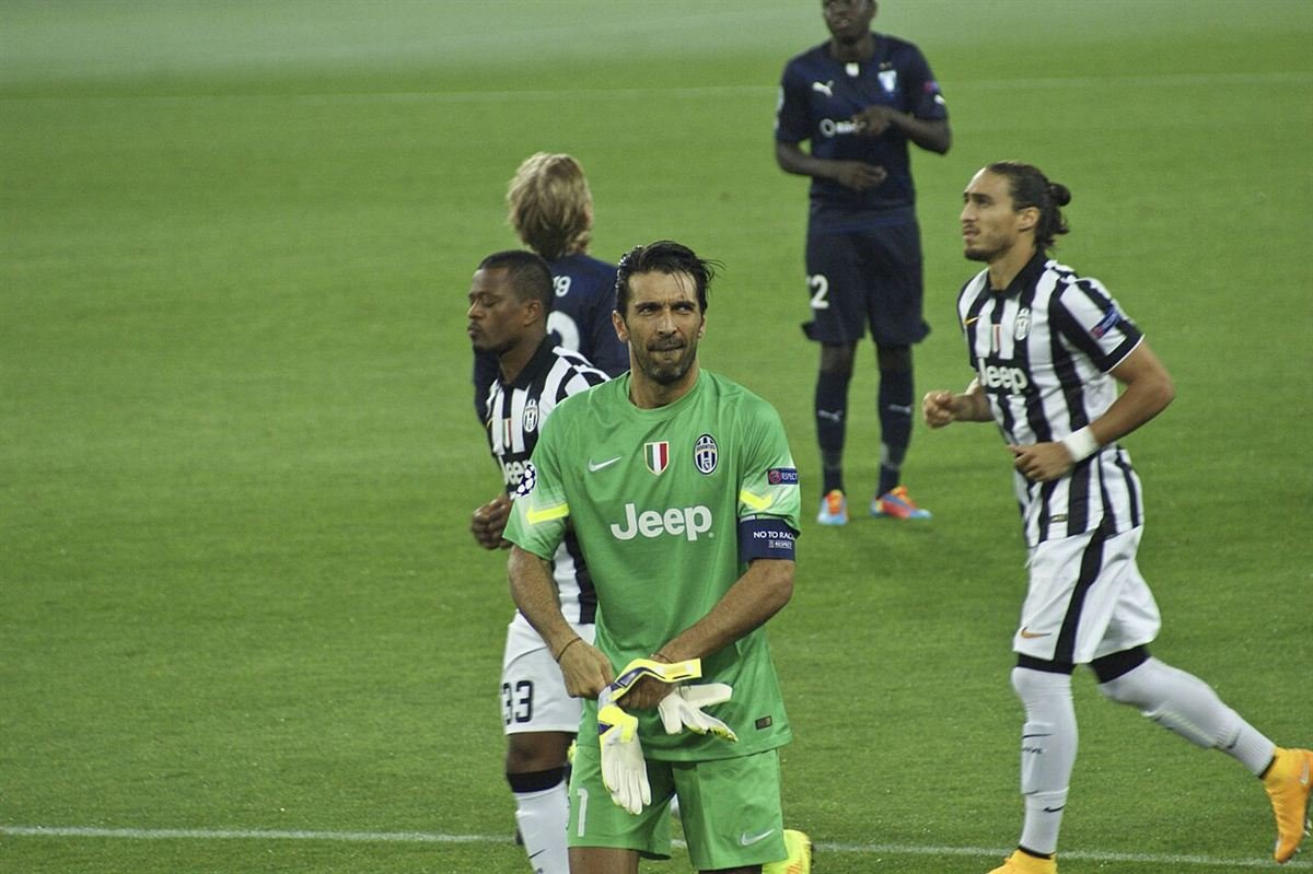 Gianluigi Buffon, Juventus captain, adjusting his gloves during a Champions League match against Malmö at Juventus Stadium in September 2014