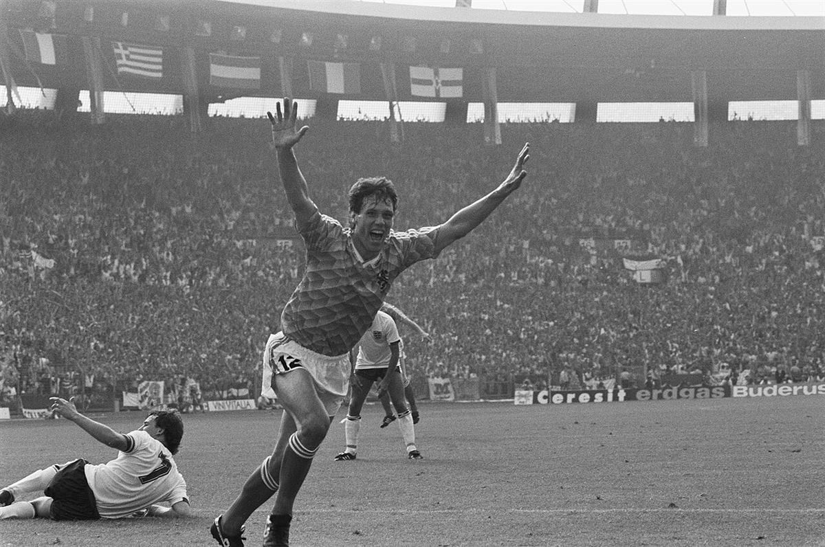 Marco van Basten celebrating with arms raised after scoring for the Netherlands against England at Euro 1988