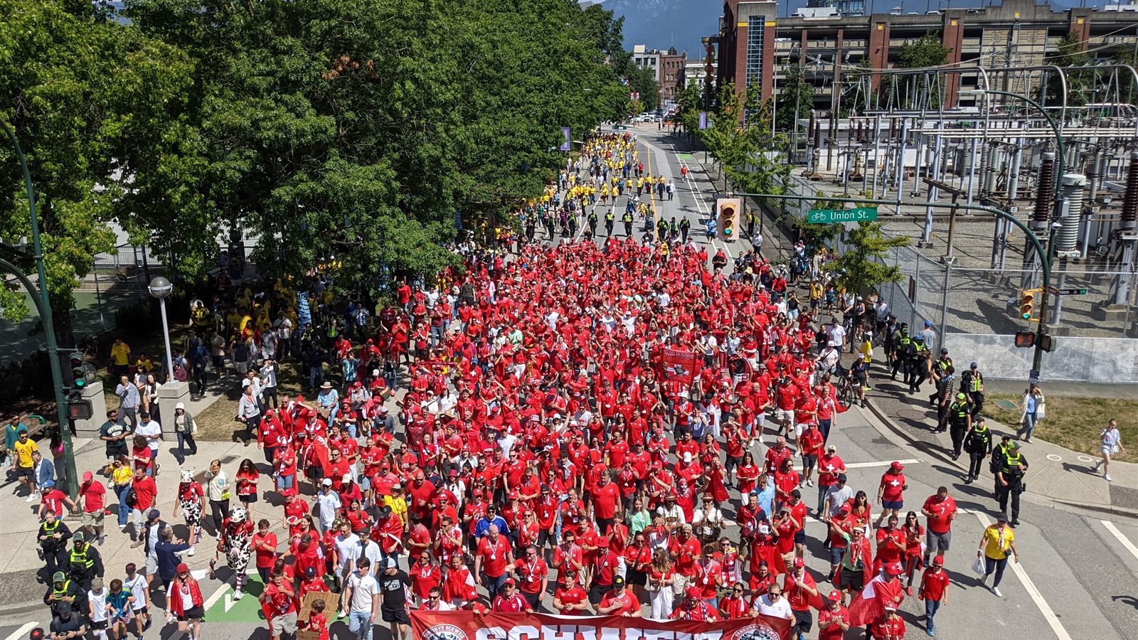 Swiss fans march through Vancouver streets on the way to BC Place before Switzerland vs Colombia at the 2026 World Cup